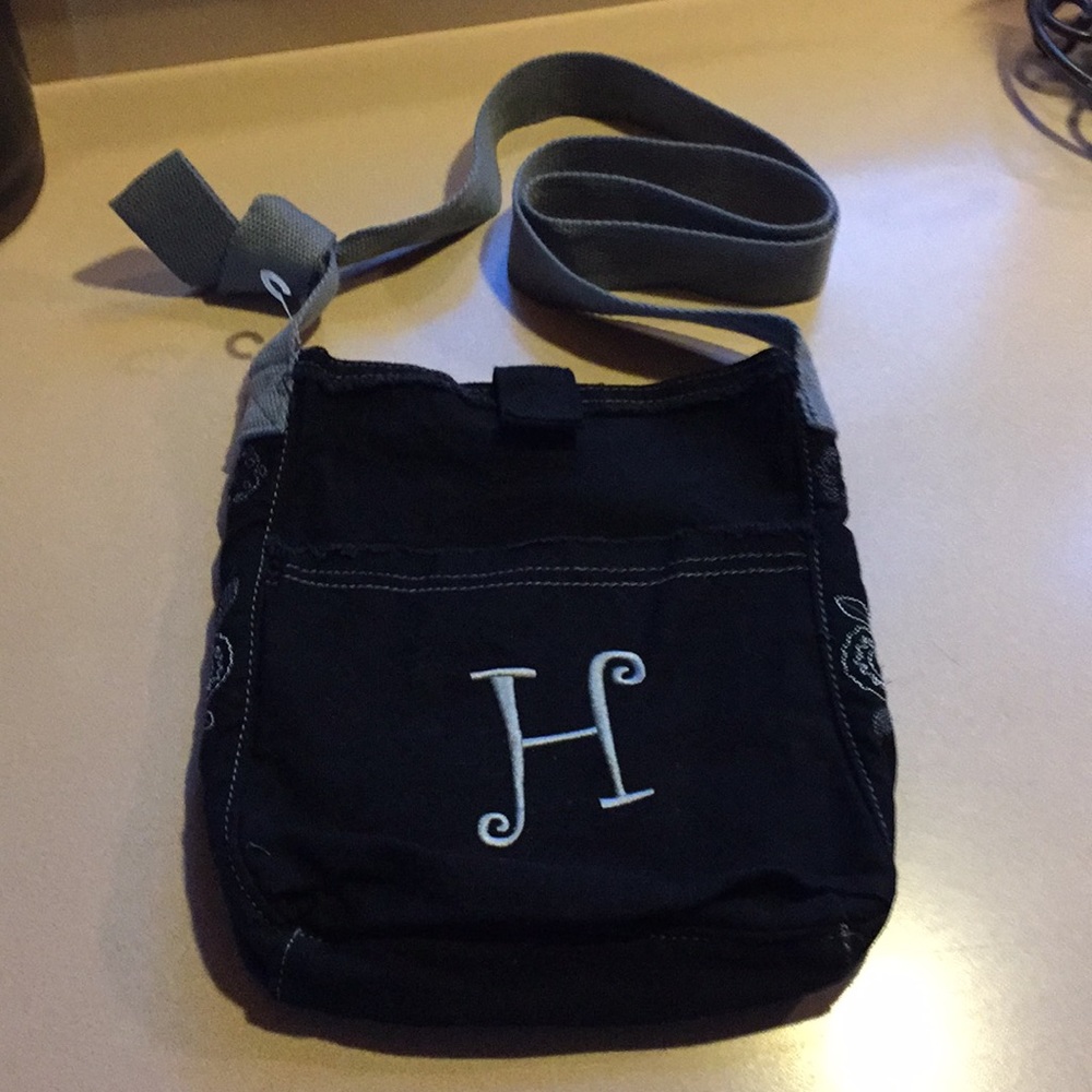 “31” black cloth crossbody bag.  H monogram.